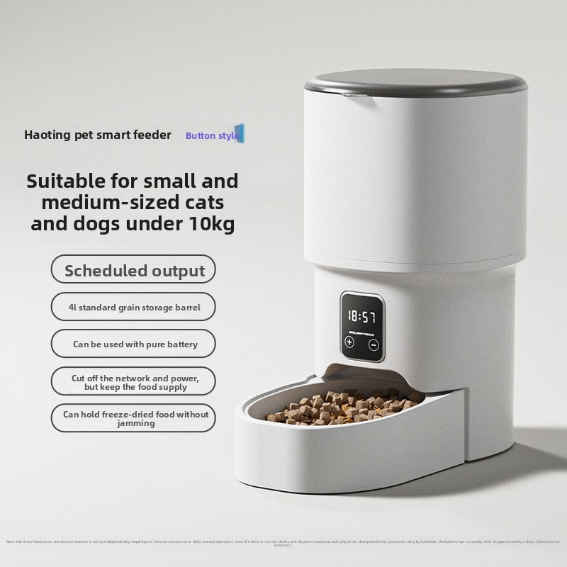 White pet smart feeder with digital display on a gray background