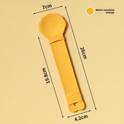 Yellow spoon with measurements on a beige background