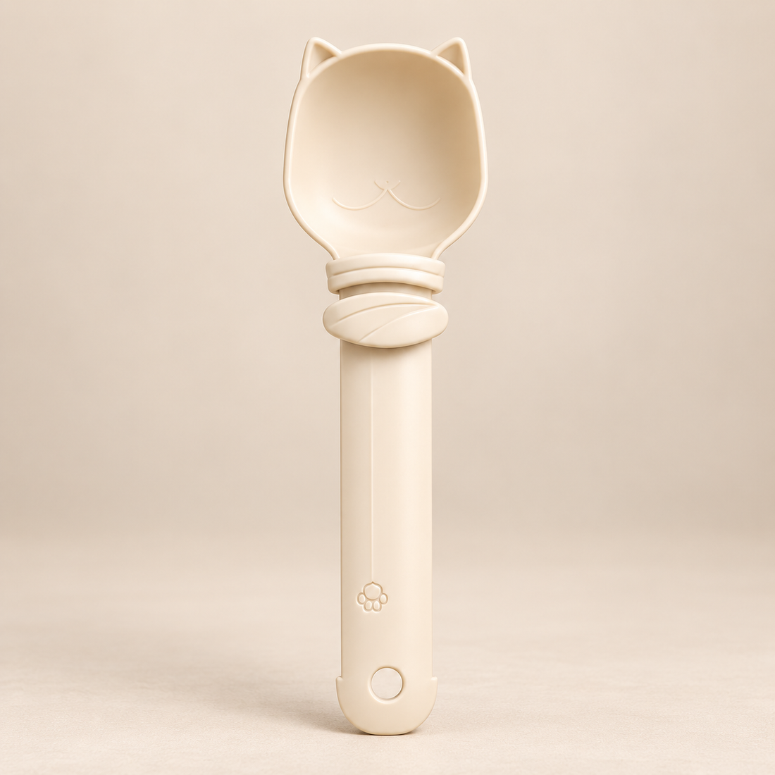 PAWLY cat spoon feeder holding a lickable treat tube