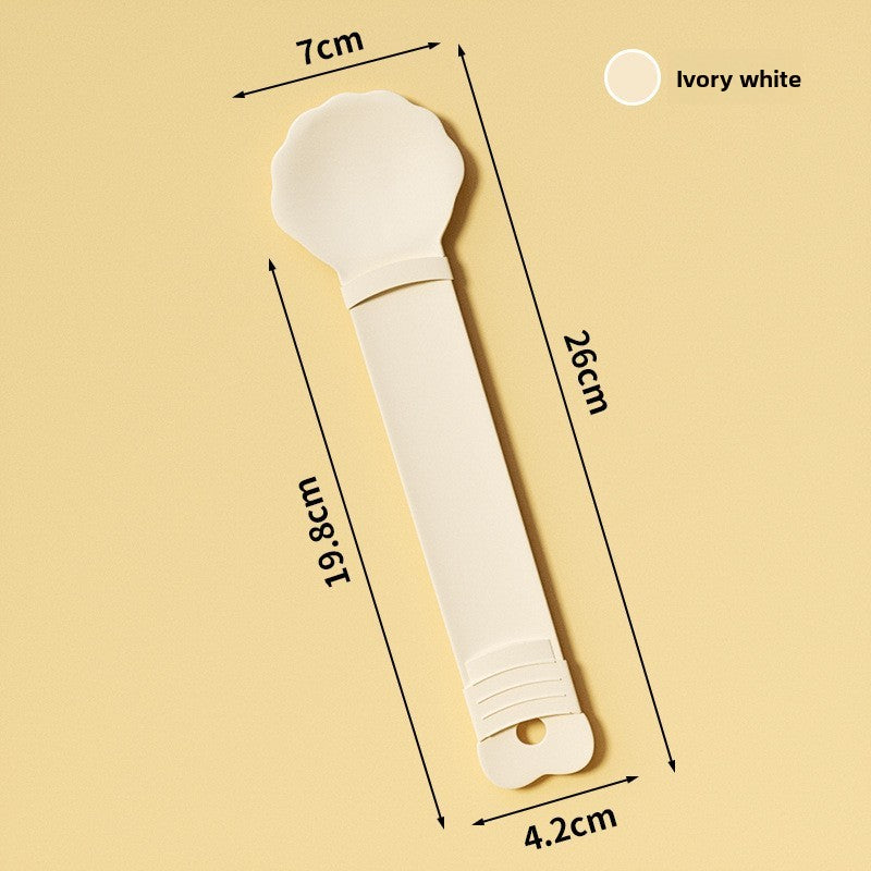 Ivory white kitchen tool with measurements on a beige background